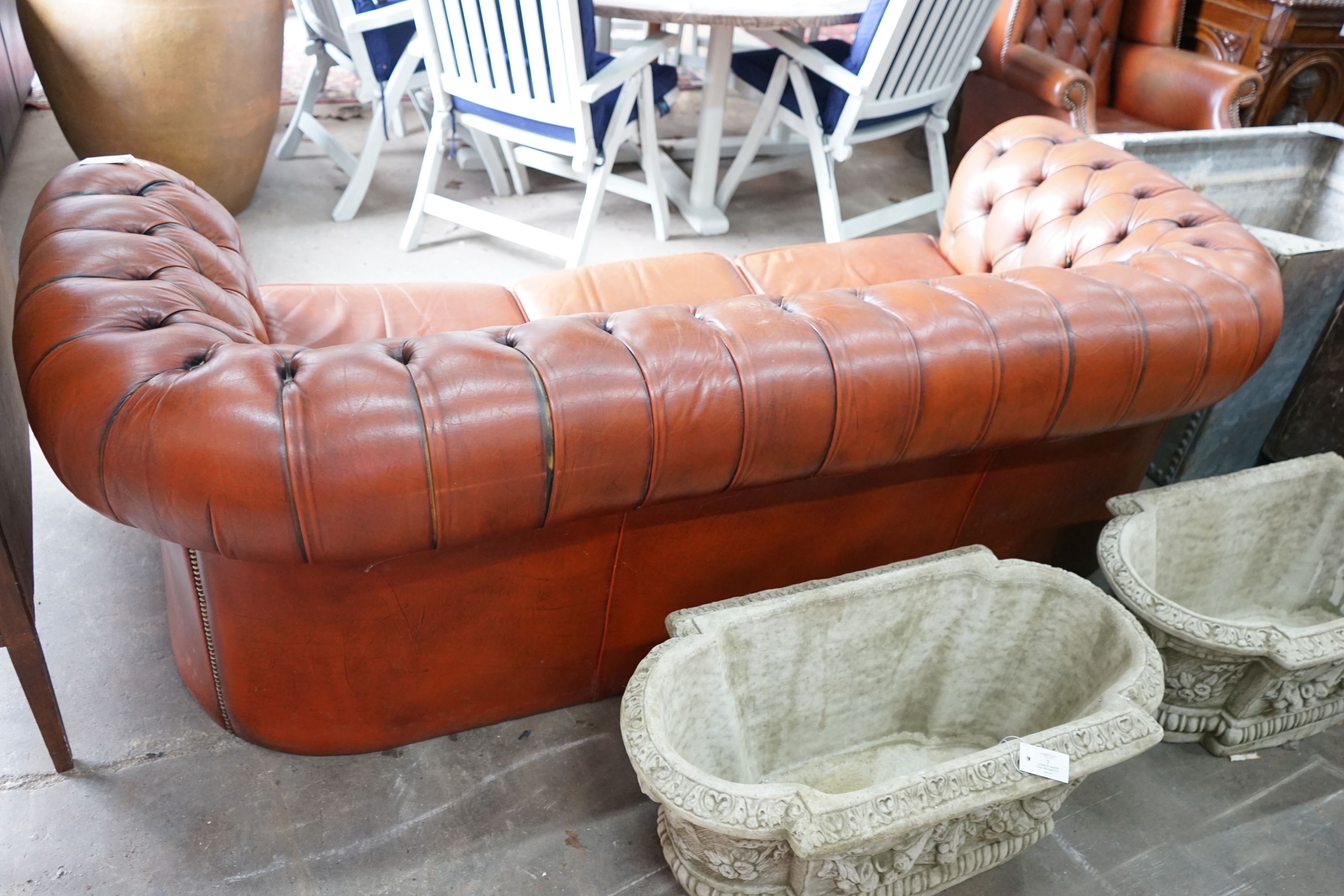 A modern Victorian style buttoned brown leather Chesterfield settee, length 200cm, depth 82cm, height 68cm